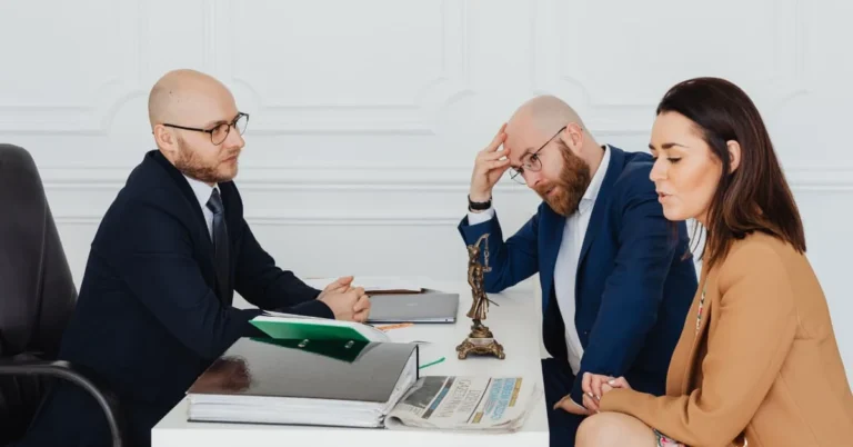 Couple meeting with a lawyer about a high-conflict divorce in Ontario